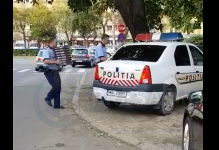 VIDEO. Poliția filmată în timp ce transportă pizza în Satu Mare
